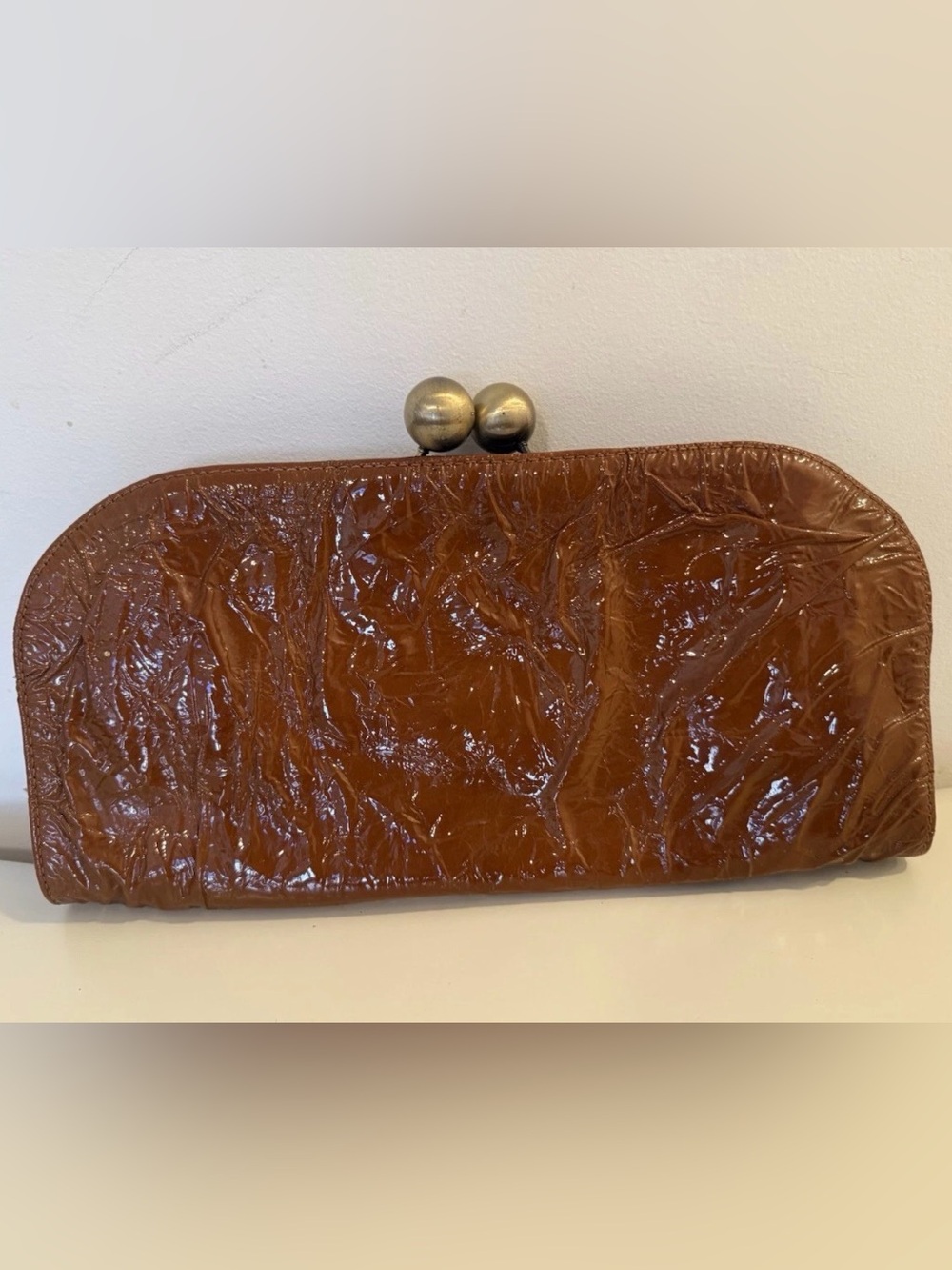 Lesa Wallace Cognac Patent
Matte Gold Twist Ball Opening
Large Clutch